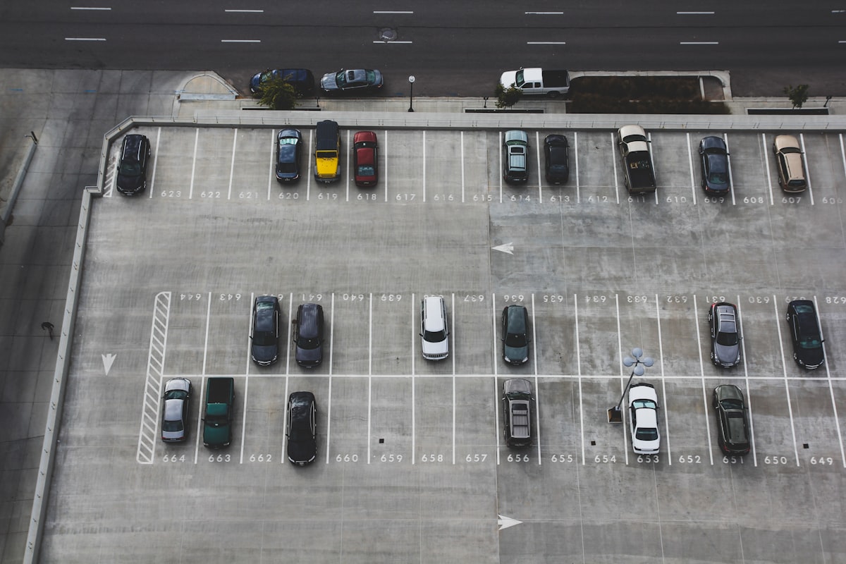 Aerial view of organized vehicle storage yard with numbered spaces